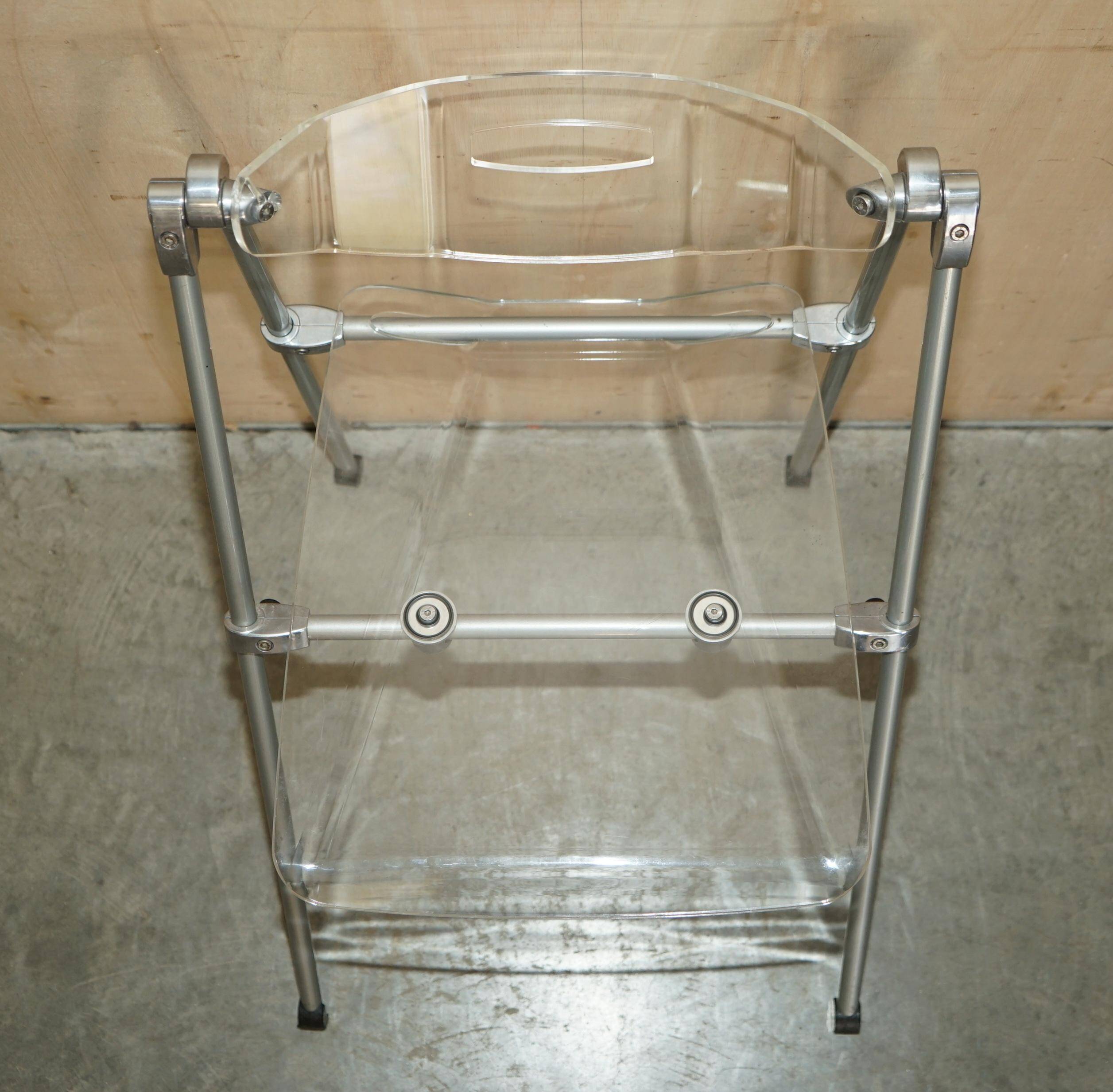 Metal and lucite folding chair, swivel backrest.