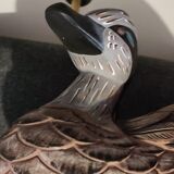 Decorative table lamp with a sculpted duck-shaped base and painted finish.