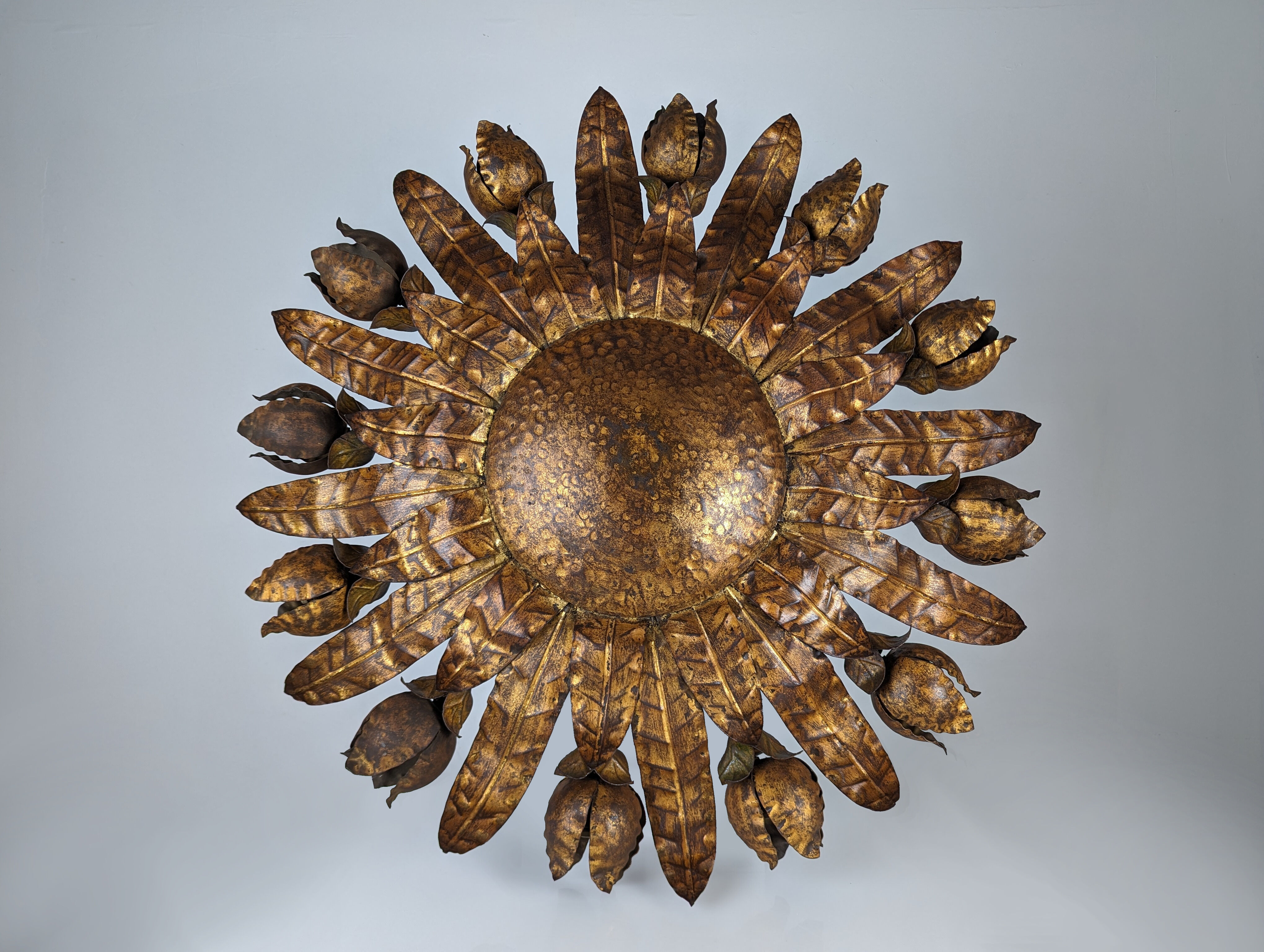 Large mid-century sunburst ceiling lamp, gilded metal with floral motif, 1950s