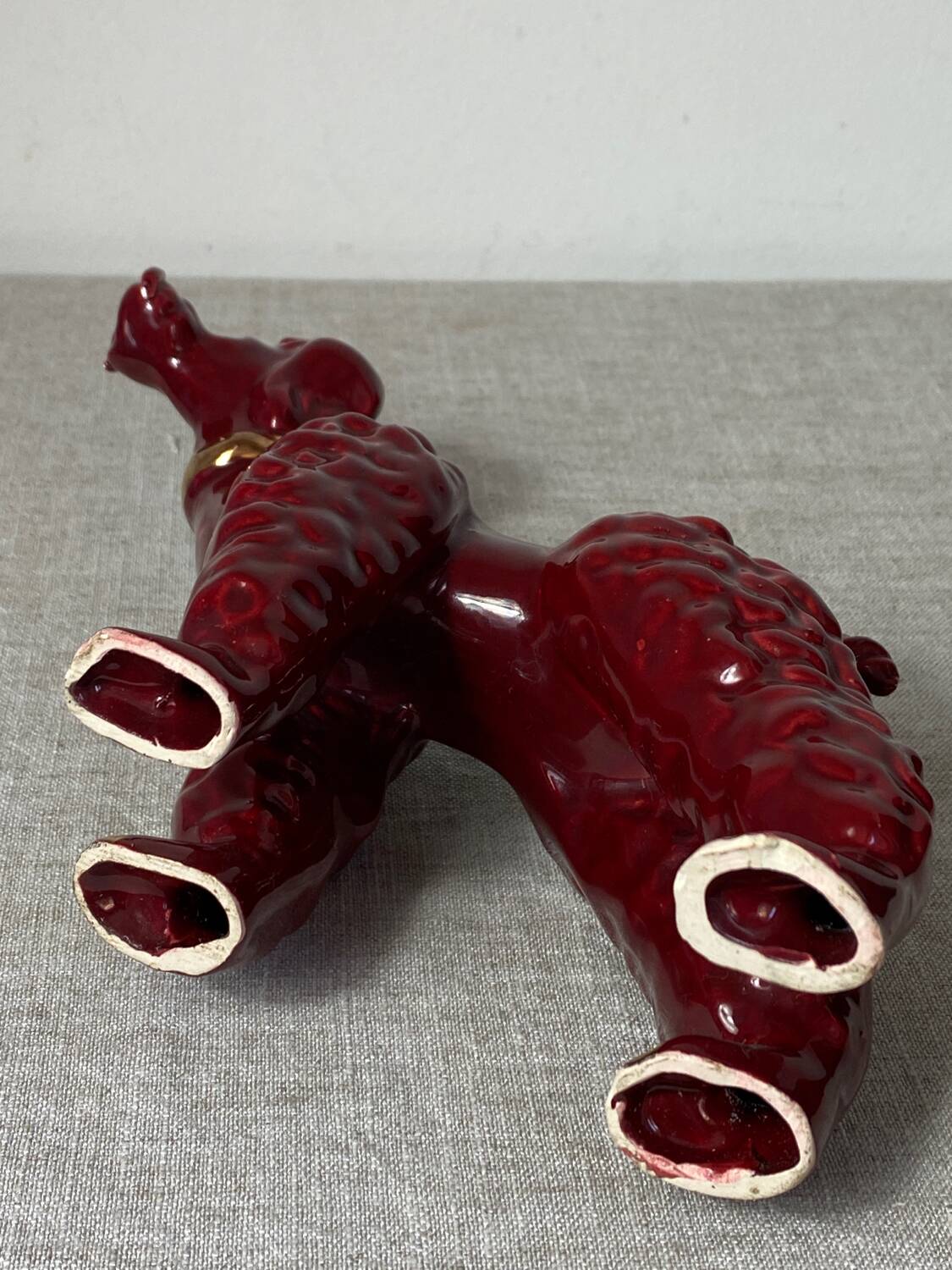 Burgundy and gold ceramic dog