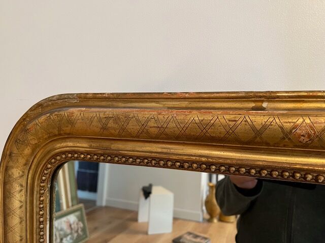 Old mirror Louis-Philippe in gilded wood