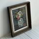 Vintage painting of flowers in a vase.