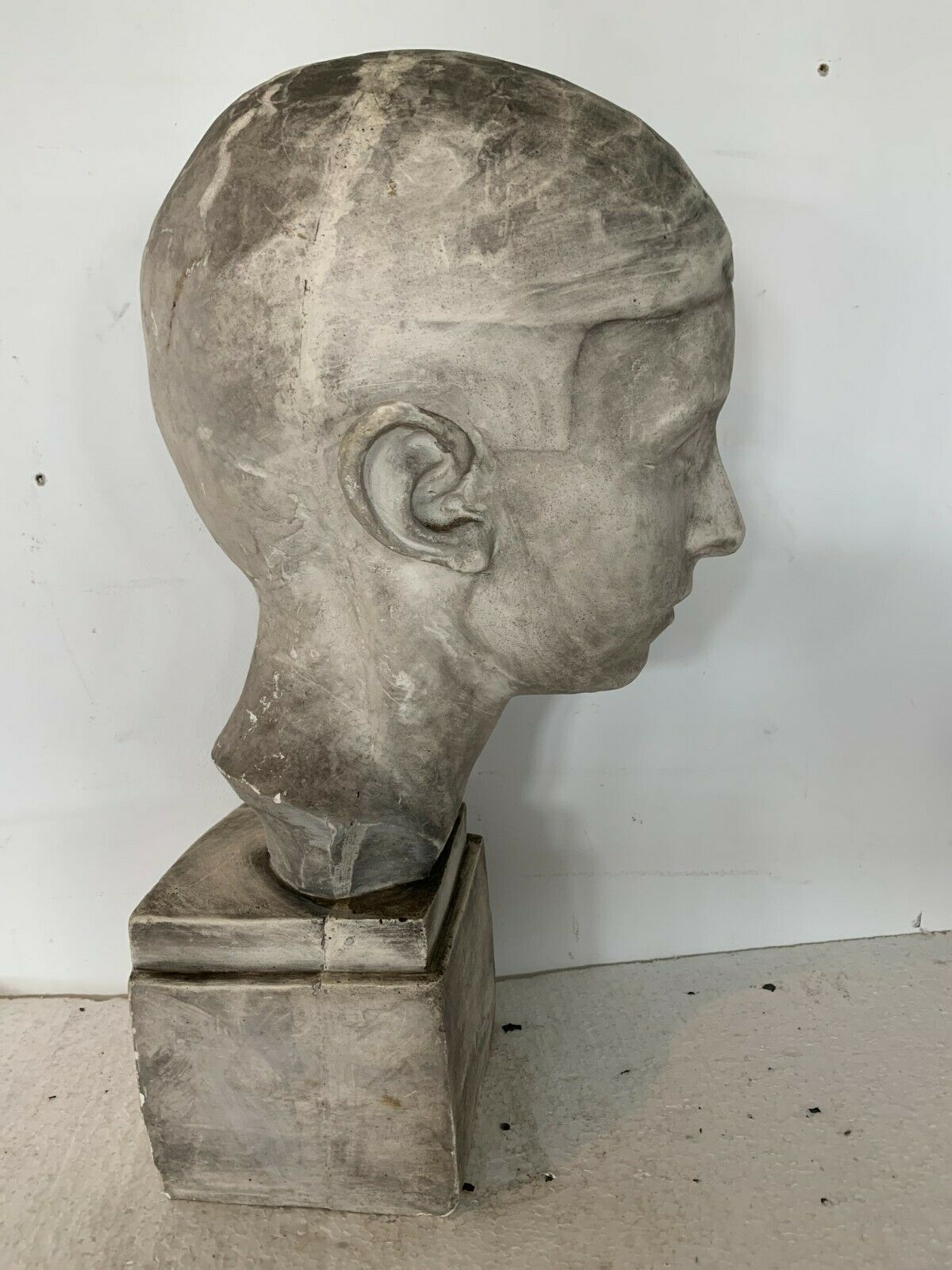 Bust of a young man in plaster signed Gerard Choain XX century