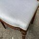 2 Louis XVI period chairs in solid wood and grey fabric.