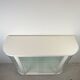White vintage slatted display case on gold legs