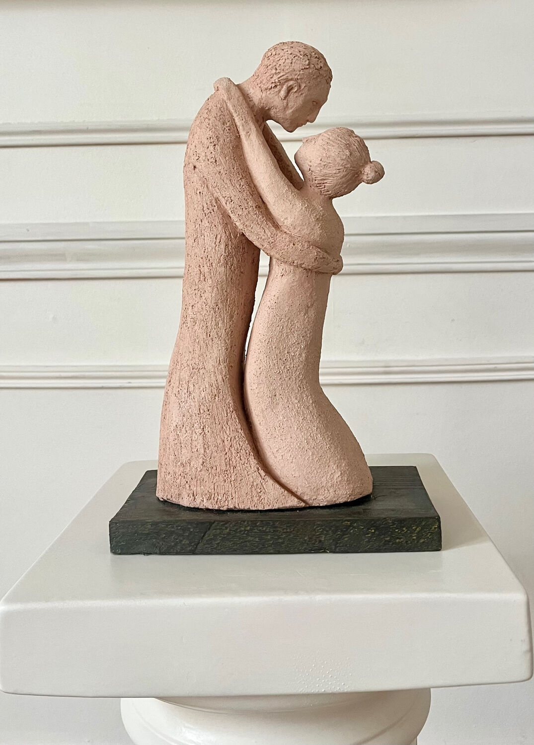 Terracotta sculpture of an entwined couple.