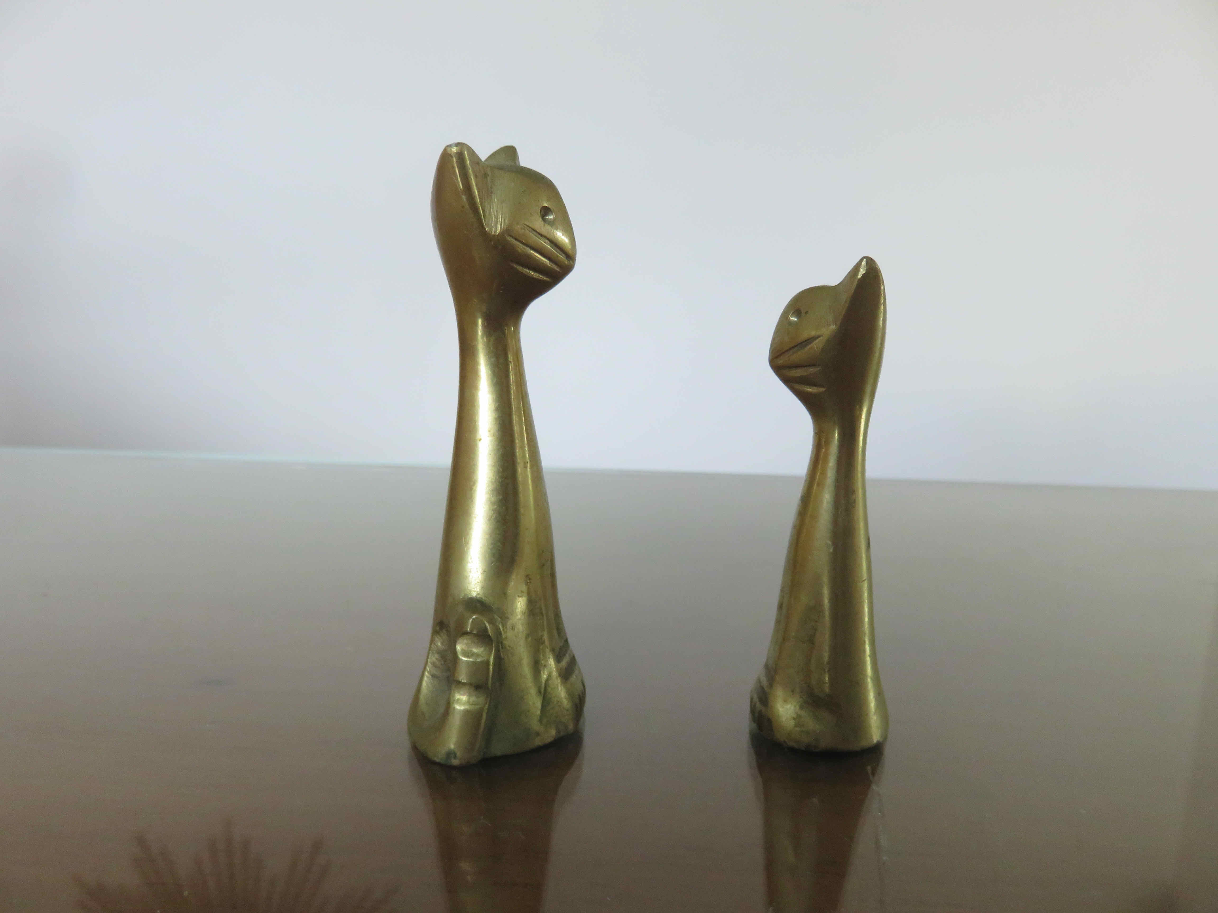 Couple of stylized cats in brass 70s