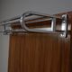 Modernist wall-mounted cloakroom in teak
