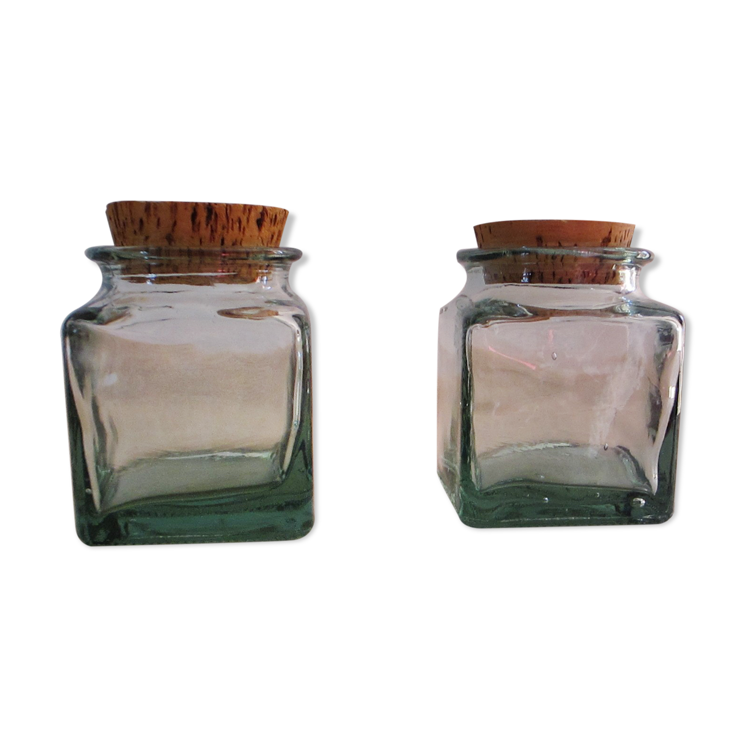 2 glass jars with crusted cork stopper