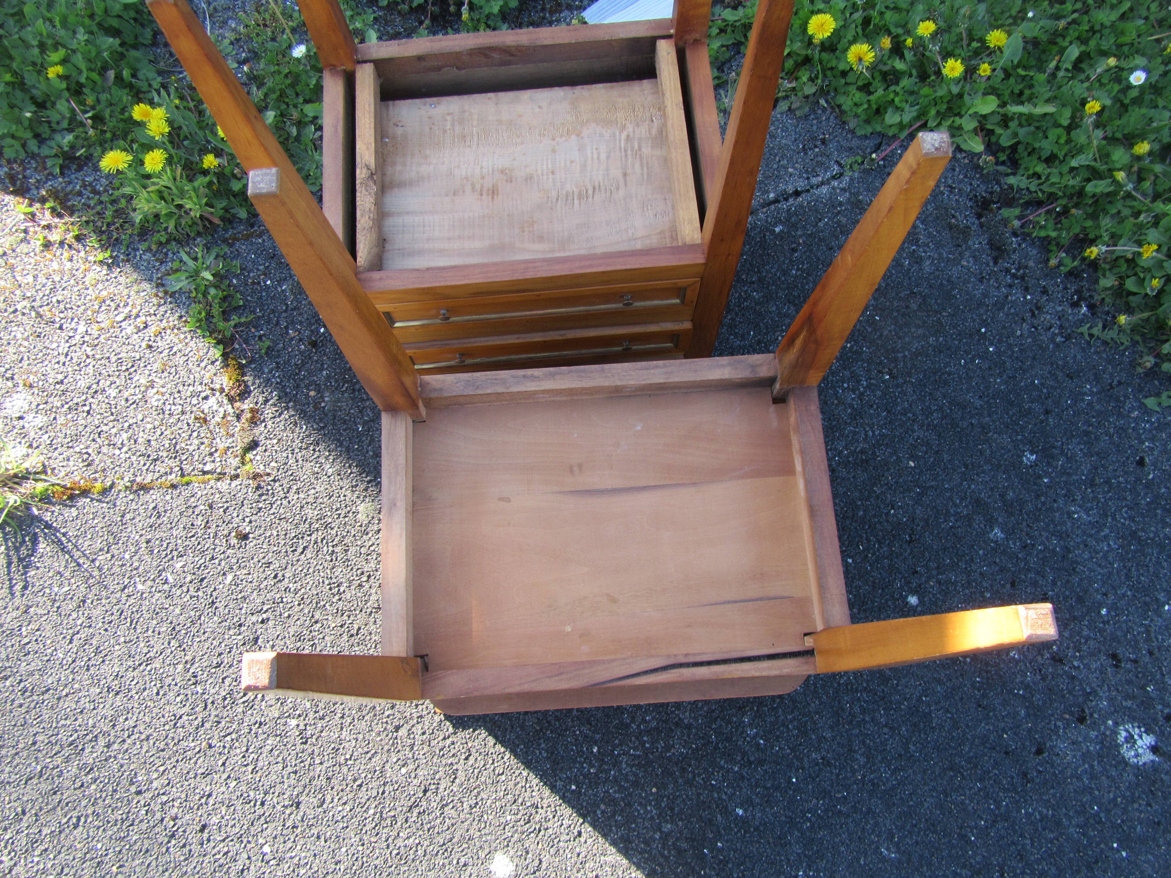 Pair of walnut bedside tables in Louis XVI style with brass inlay.