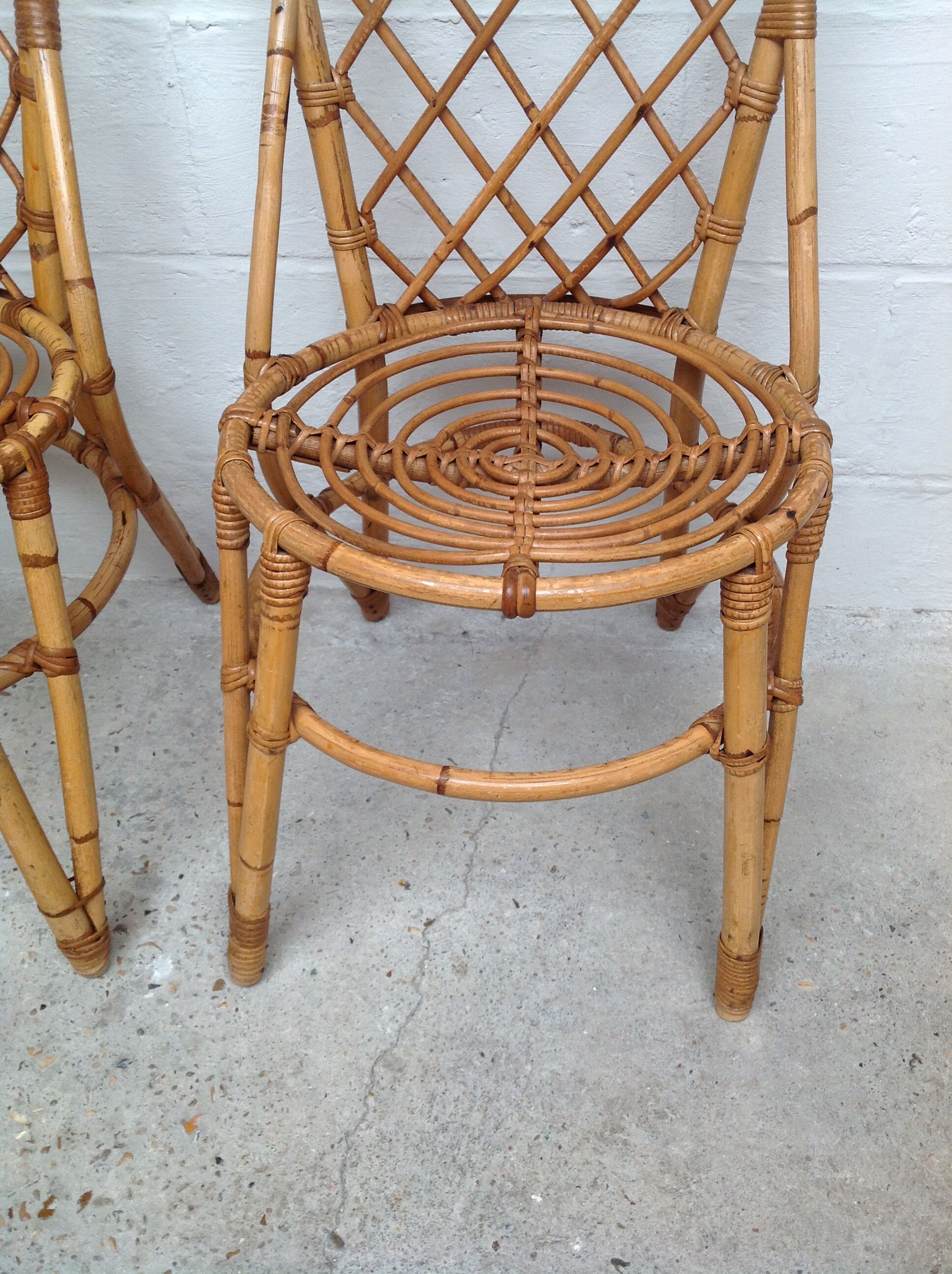 Pair of rattan chairs by Louis Sognot