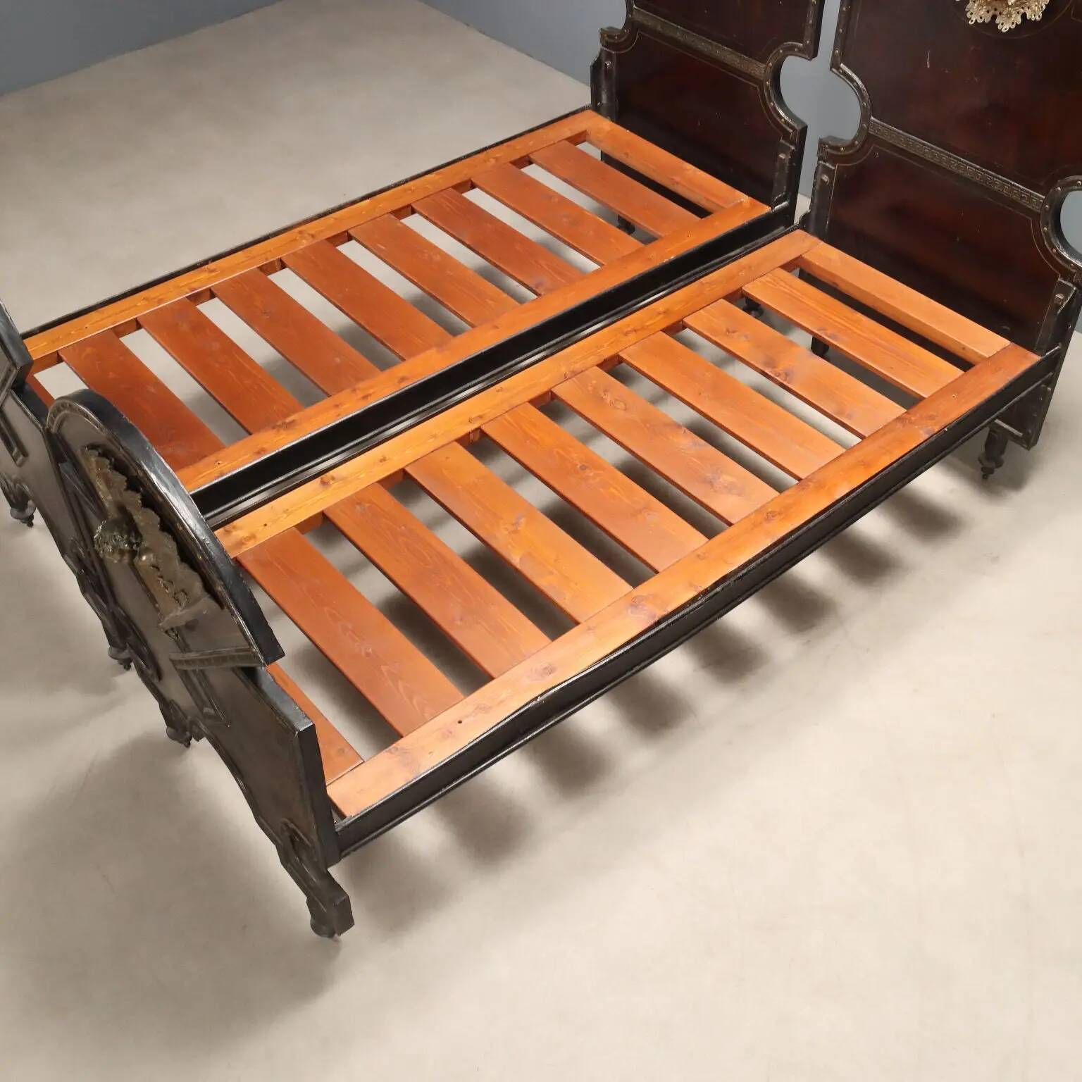Pair of antique single beds in metal and bronze, Italy, 19th century.