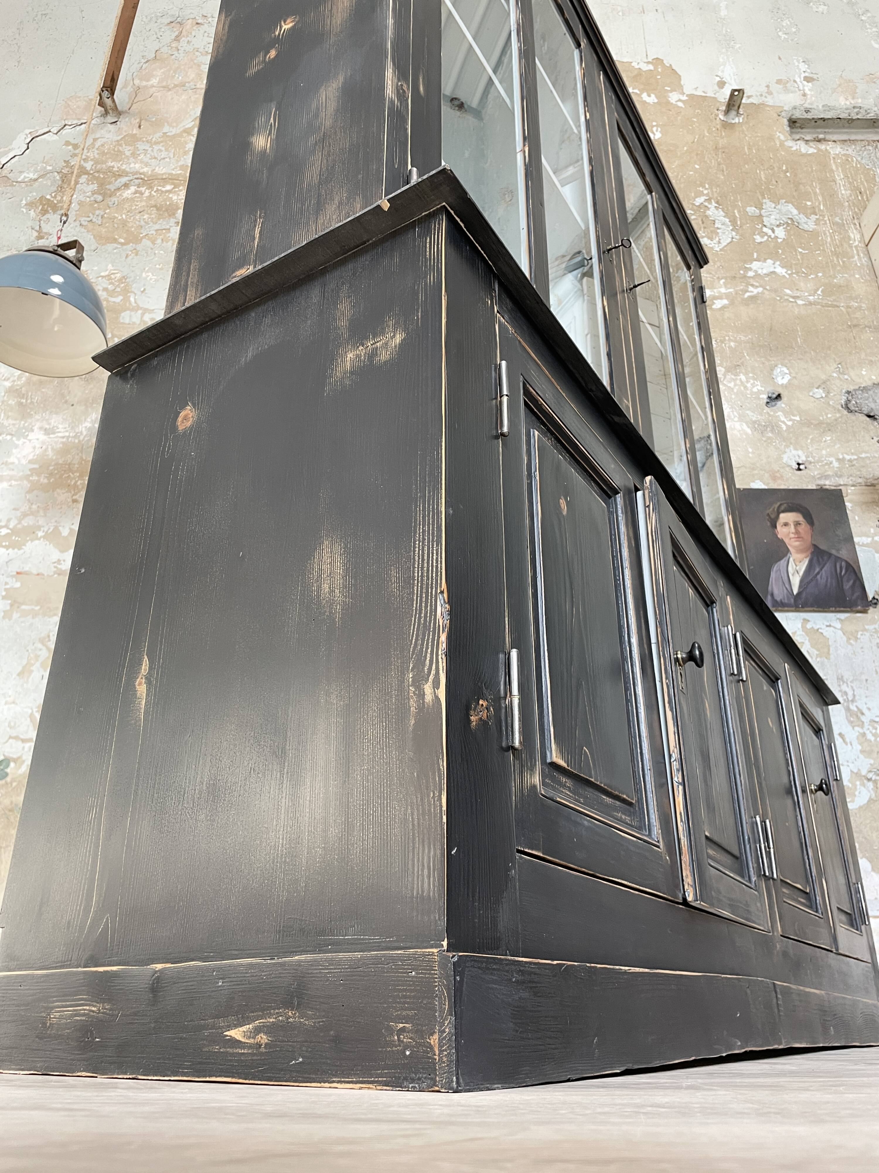 Display cabinet in patinated wood
