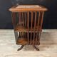 Rotating walnut library with a marble top.