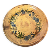 Grand plat rond vintage en céramique émaillée à décor floral