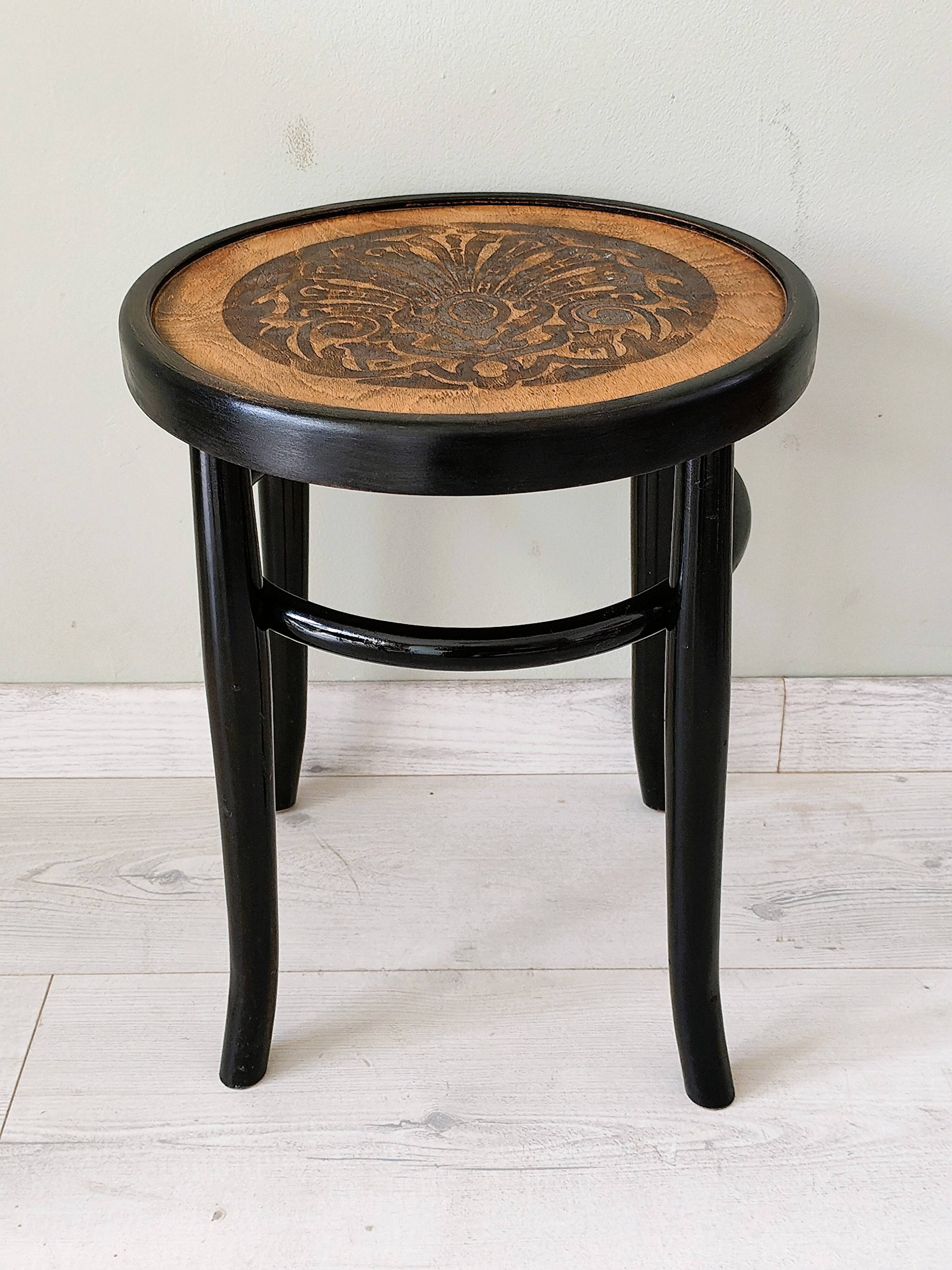 Stool in the style of Thonet made of solid wood.