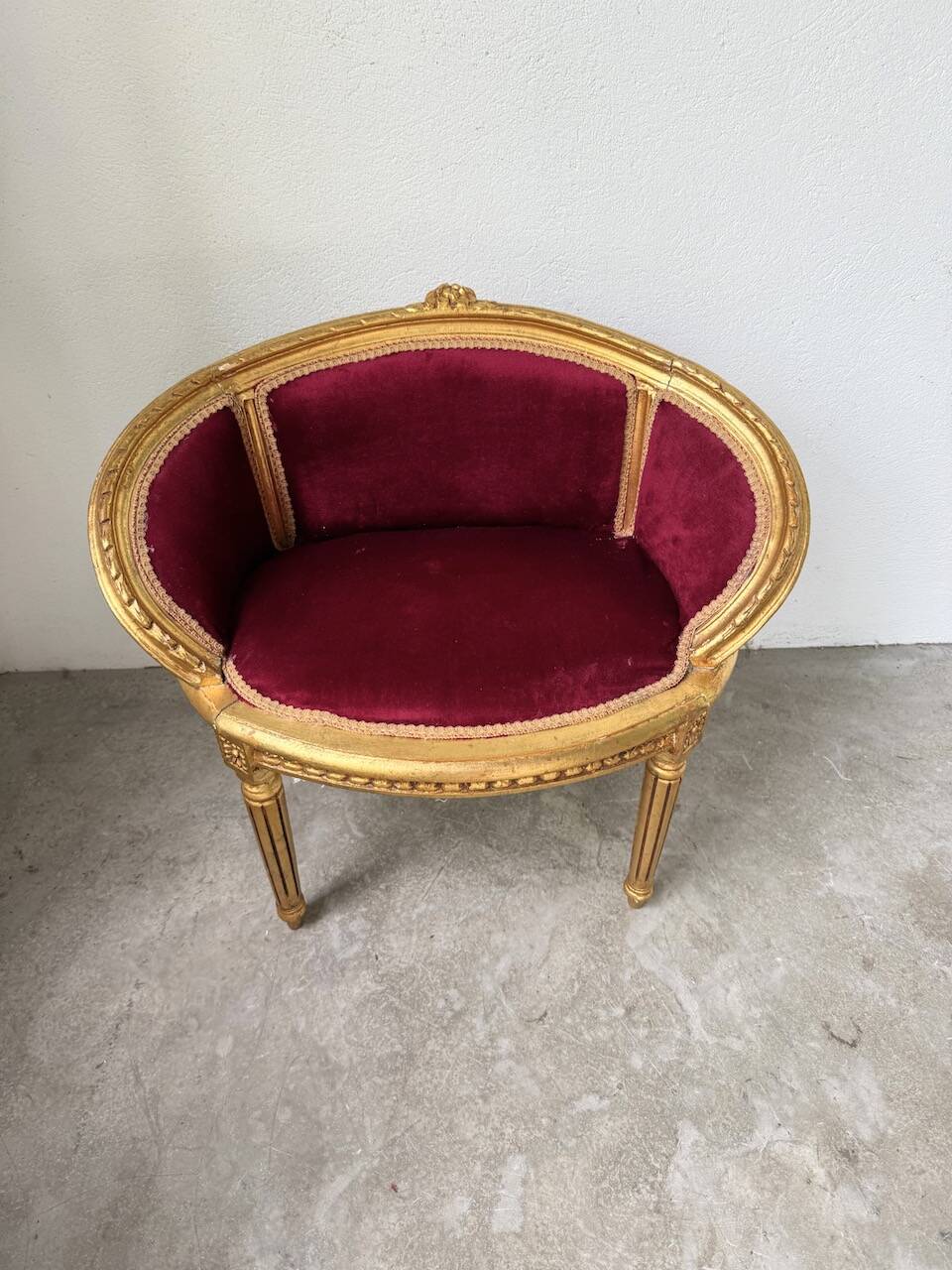 Louis XVI gilt wood and red velvet armchair