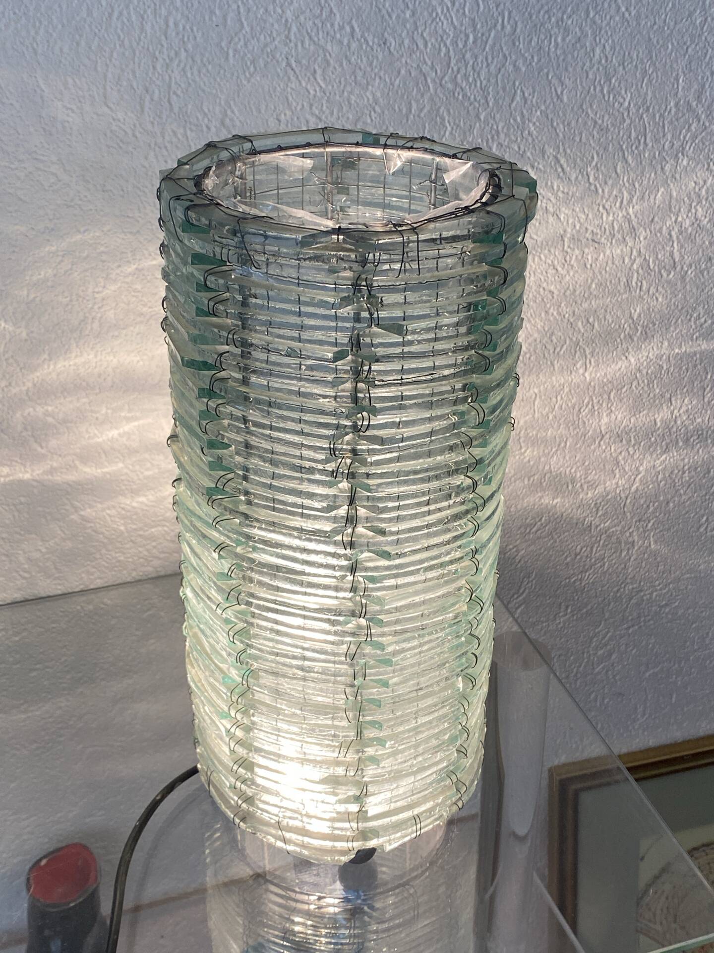 Blue-tinted glass lamp and wire.