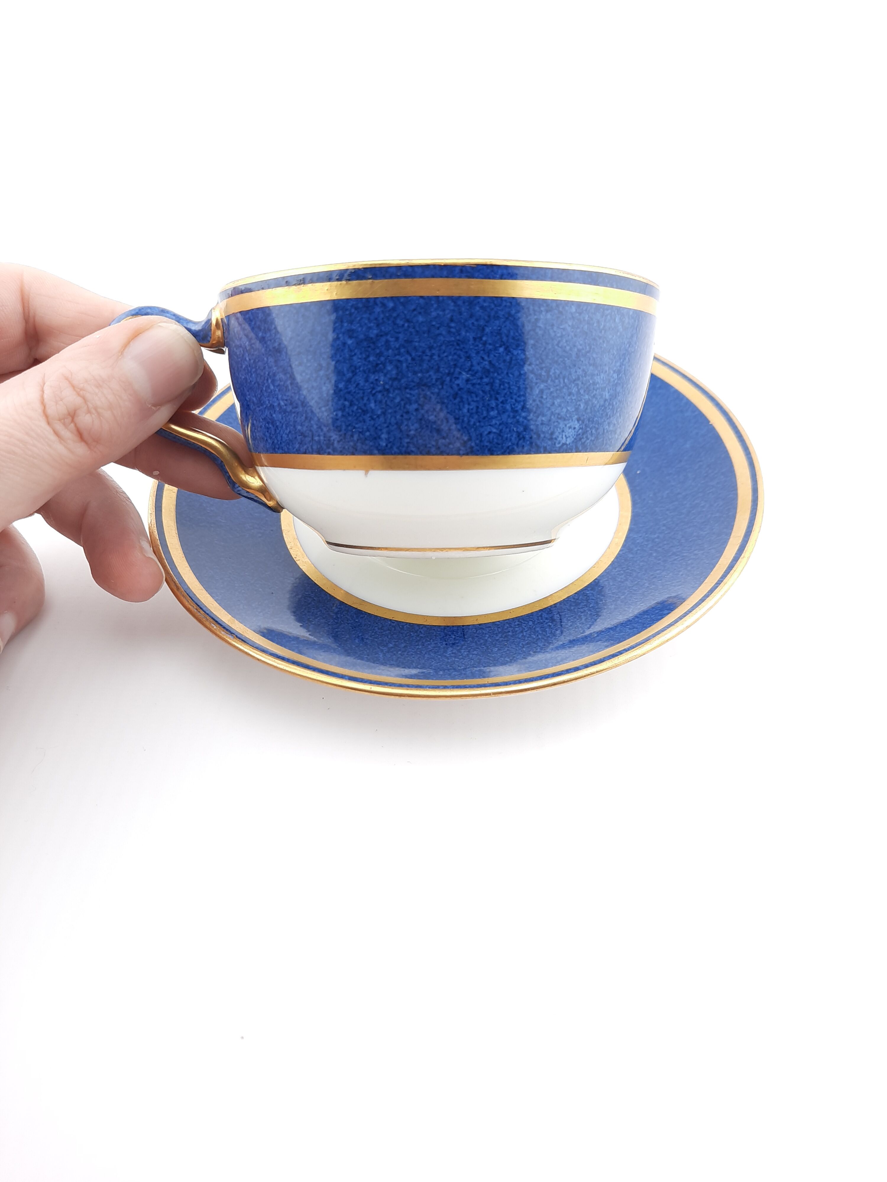 Antique Wedgwood teacup and saucer, bone china. Powder blue and gold English cup and saucer, 1900s