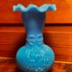 Blue opaline vase, opaque glass, wavy neck/rim, relief decoration of a bow.