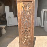 Rectangular Indonesian construction element with blue and yellow plant in carved wood