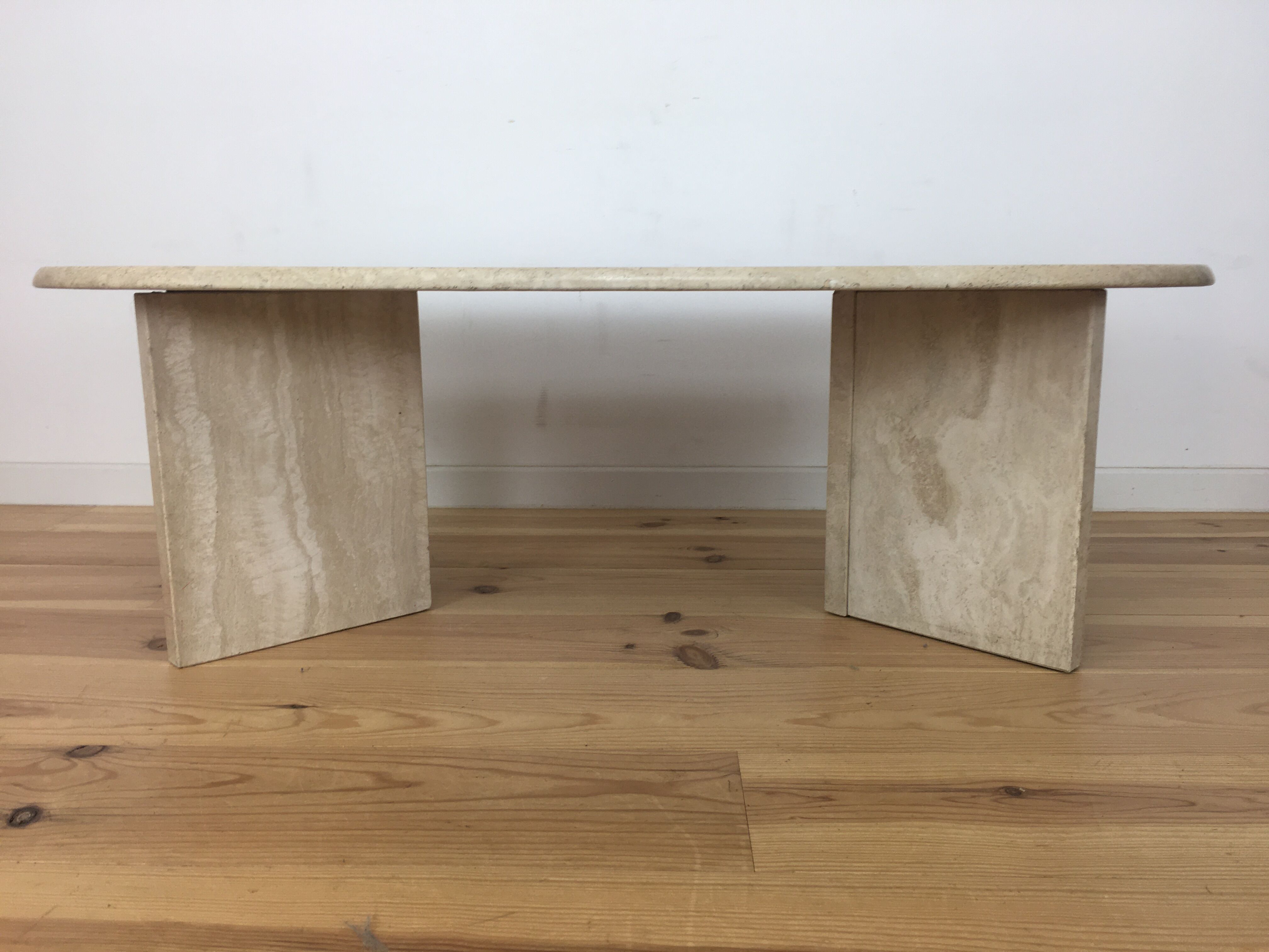 Oval coffee table in travertine