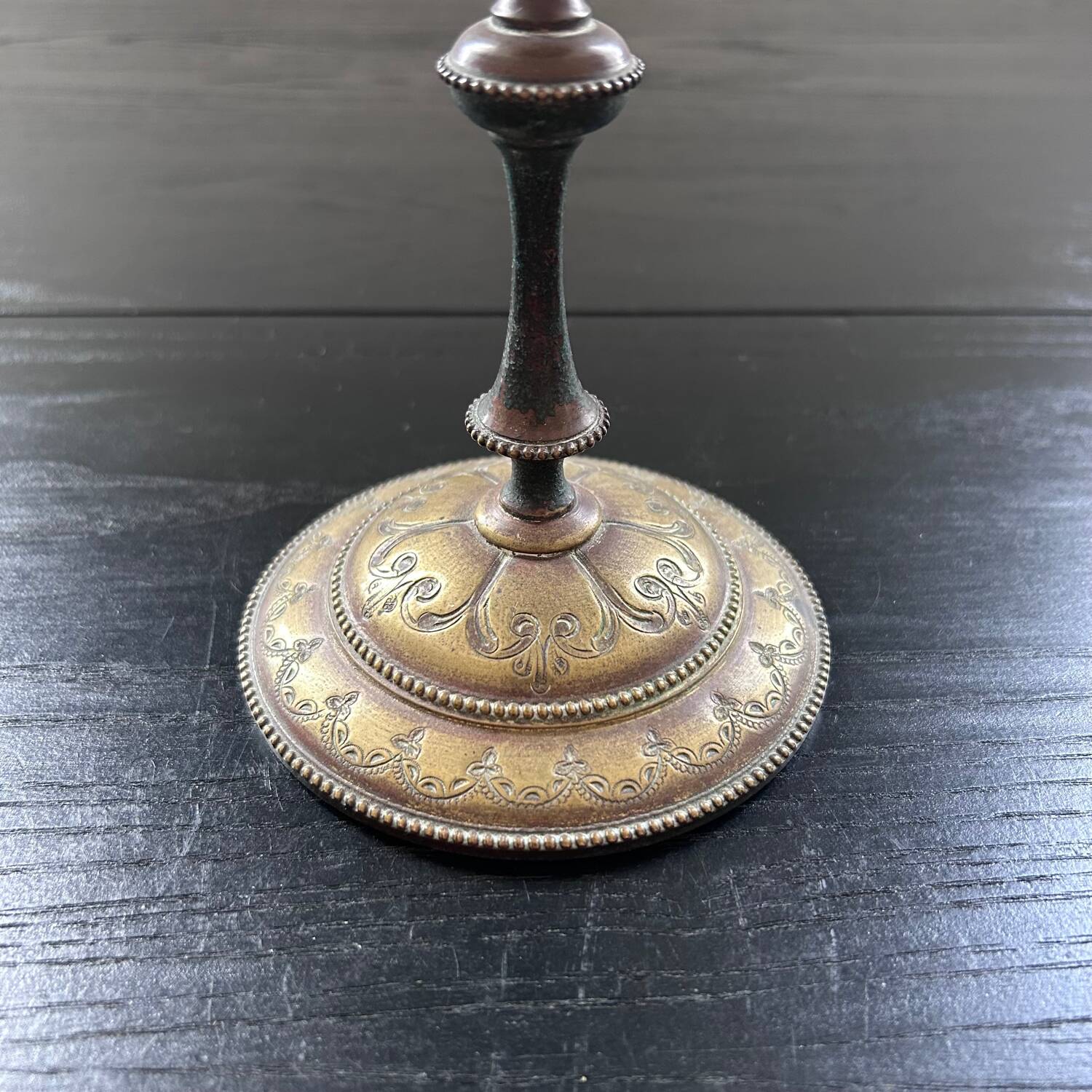Chiseled brass candlestick
