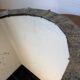 Brutalist round hammered gold metal mirror