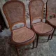 Set of 6 antique Louis XVI style dining chairs with caning.