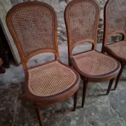 Set of 6 antique Louis XVI style dining chairs with caning.