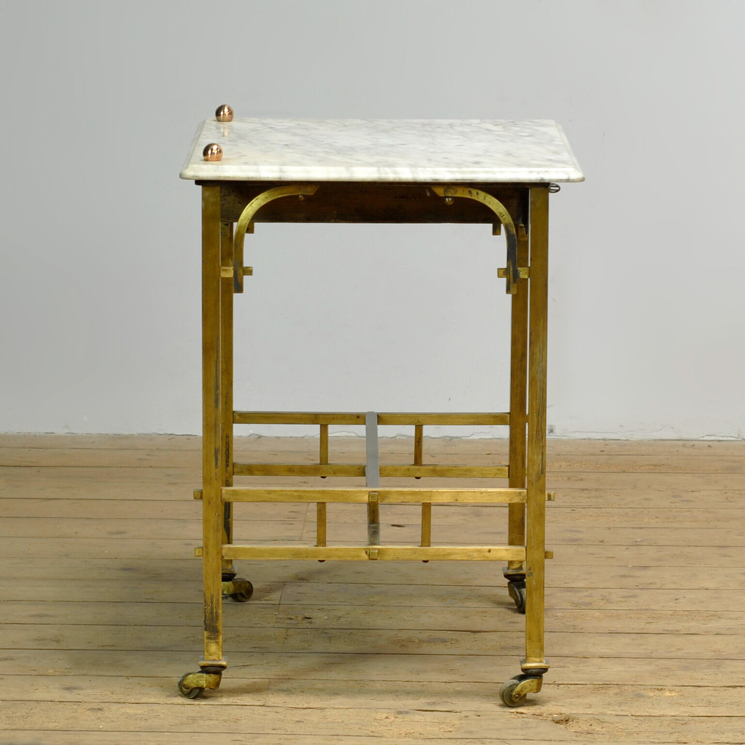 Small brass table with marble top, circa 1910