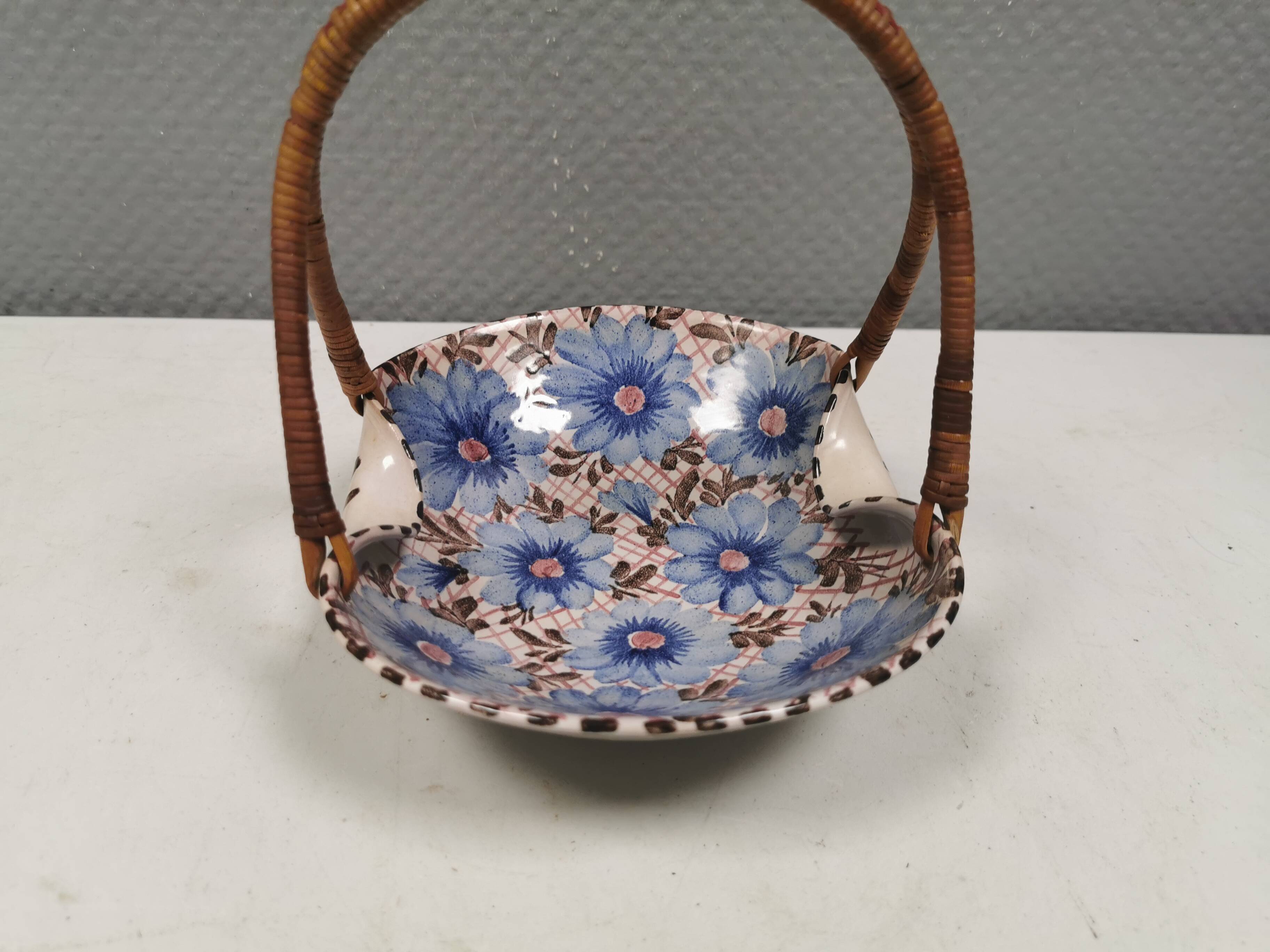 Beautiful small painted ceramic basket with woven handle