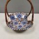 Beautiful small painted ceramic basket with woven handle
