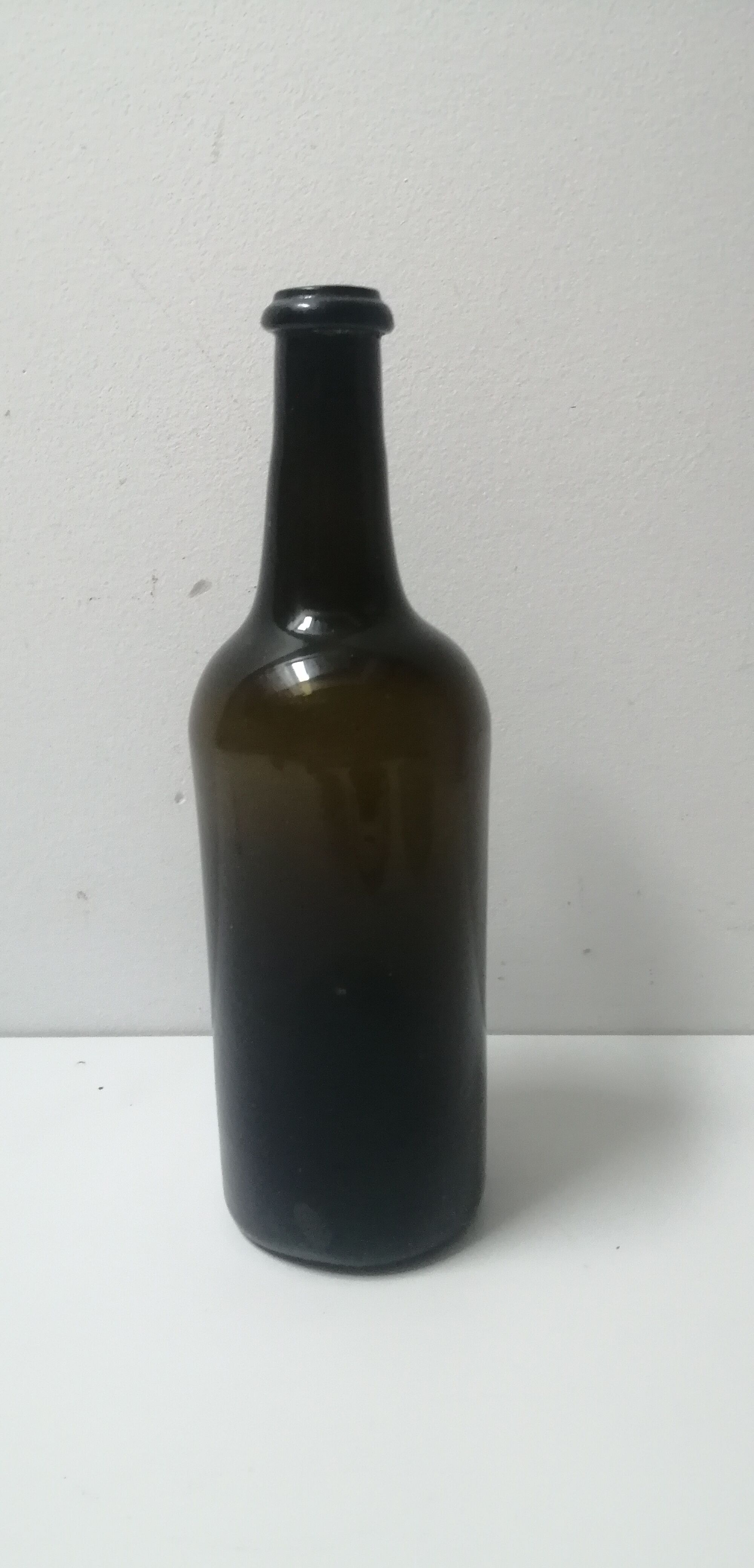 Old bottle made of blown glass