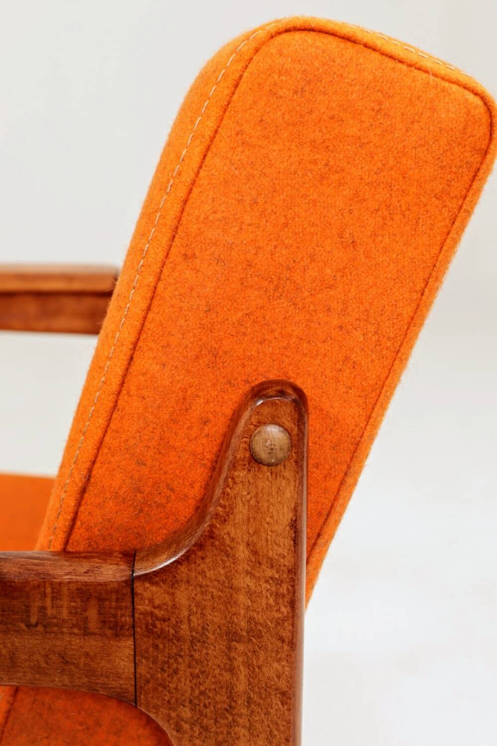 Vintage armchair in papaya orange wool from the 1960s.