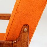 Vintage armchair in papaya orange wool from the 1960s.