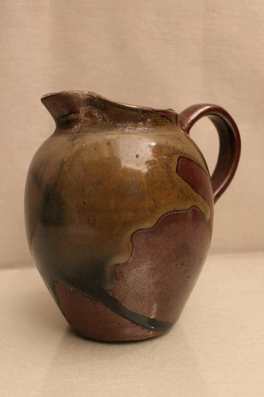 Pitcher in glazed sandstone