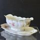 Very pretty sauce boat on a Limoges porcelain terrace in very good condition.
