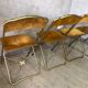 Quatre chaises pliantes velours et laiton
