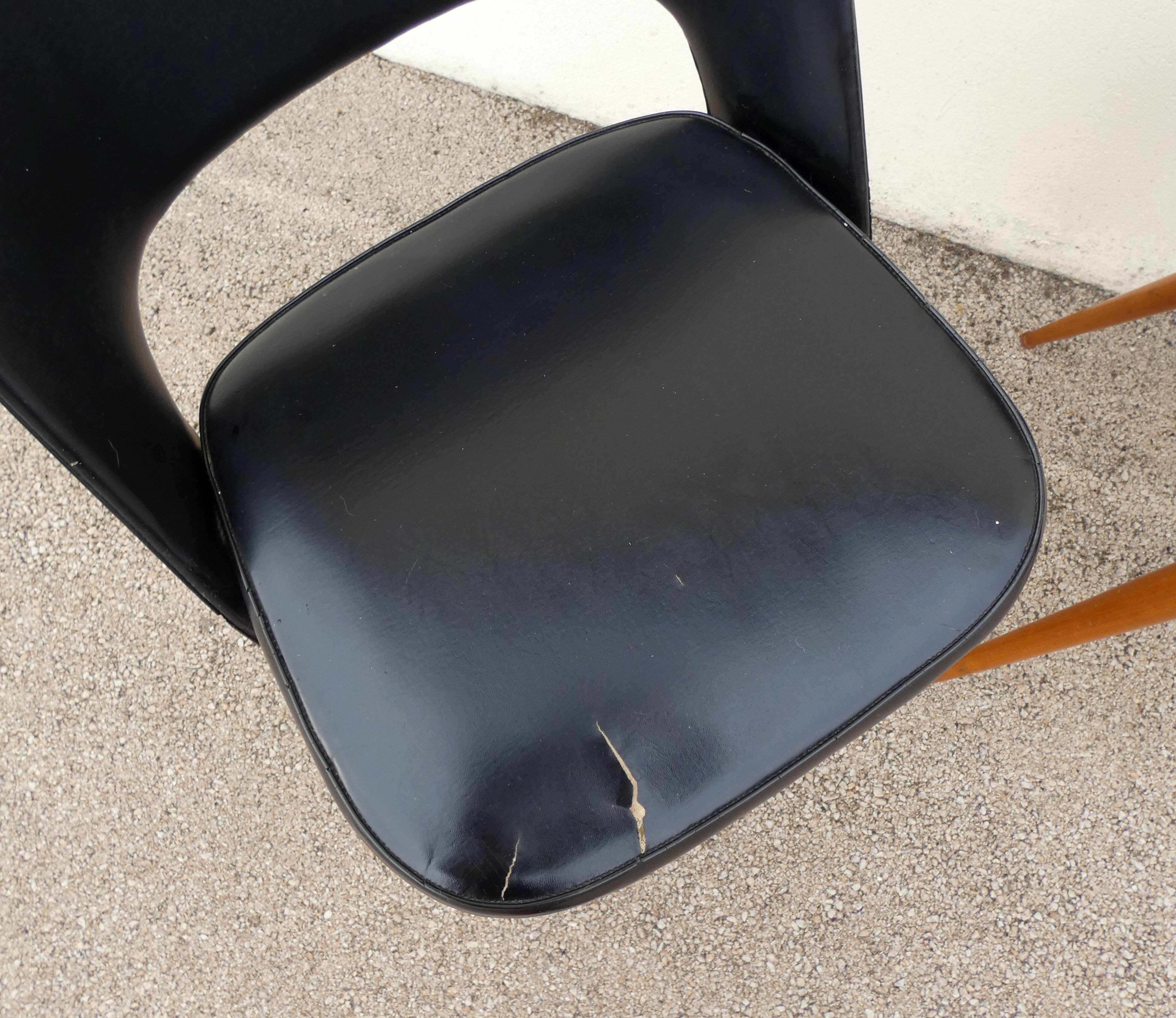 2 chairs in black skai compass legs Louis Paolozzi