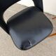 2 chairs in black skai compass legs Louis Paolozzi