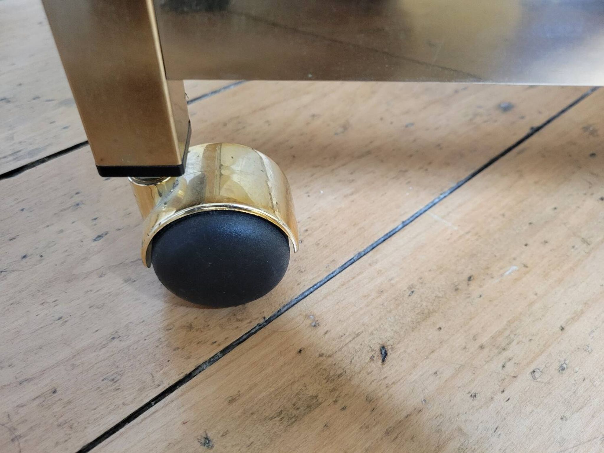 Gold metal and smoked glass serving trolley