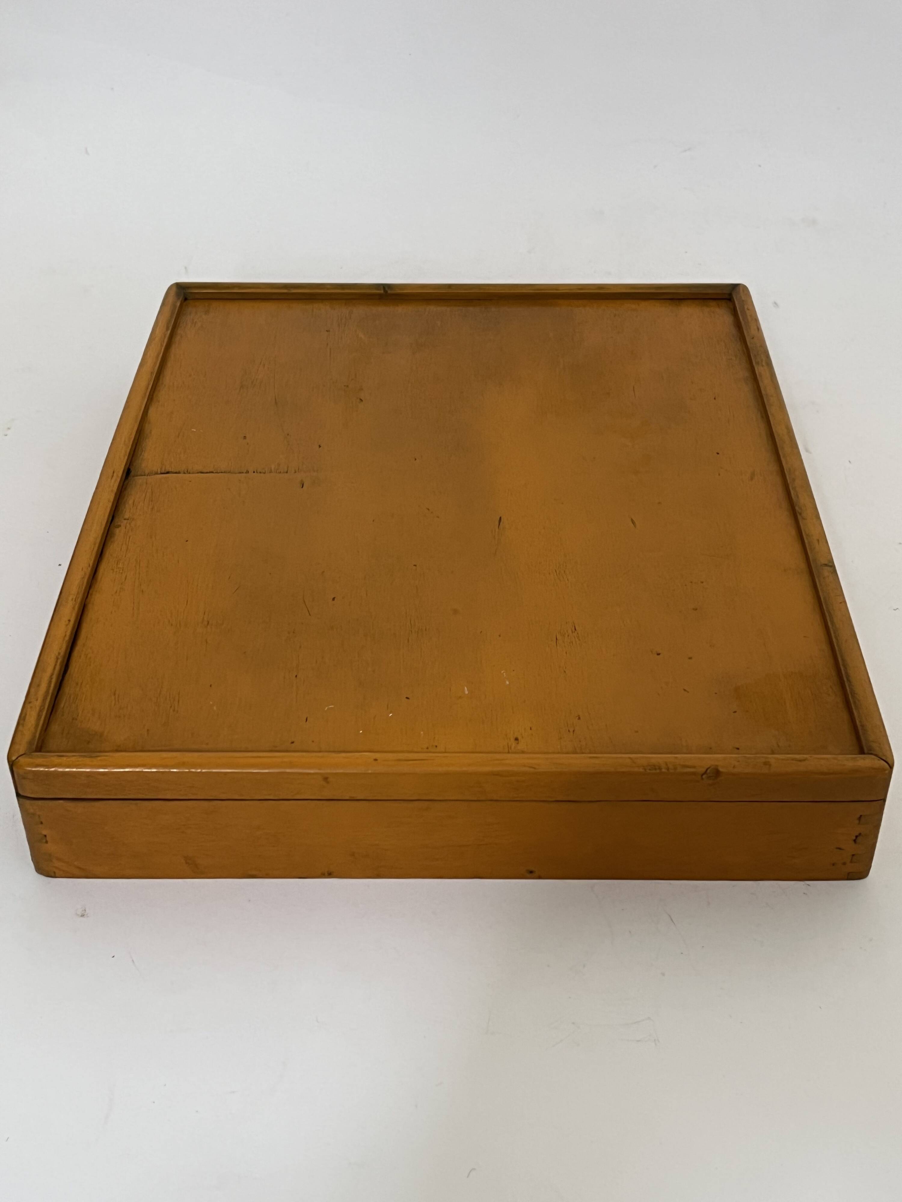 Old game of nain jaune with its bone tokens.