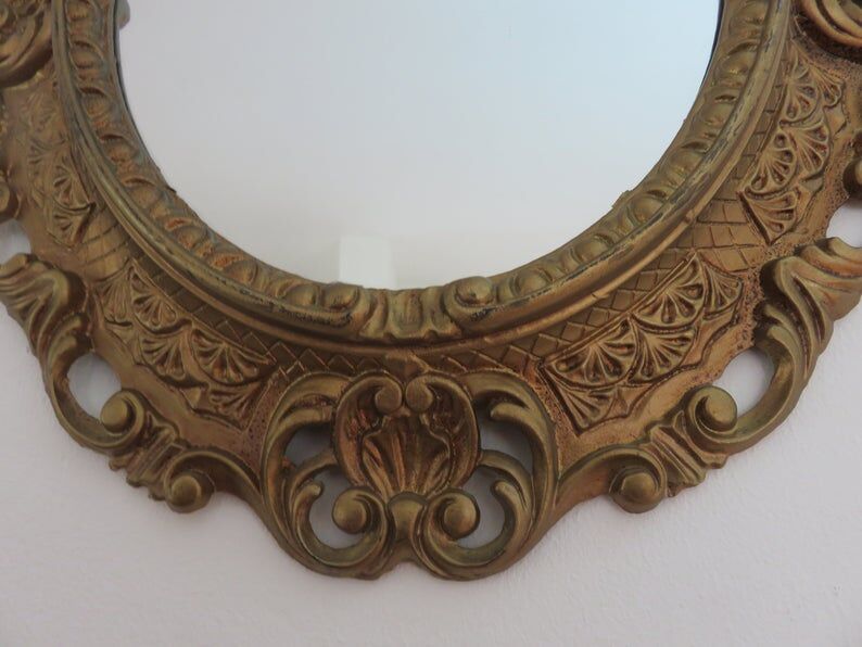 Golden baroque oval mirror, 60s-70s