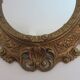 Golden baroque oval mirror, 60s-70s