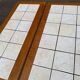 Dining table or farmhouse kitchen style with solid wood and tiles.
