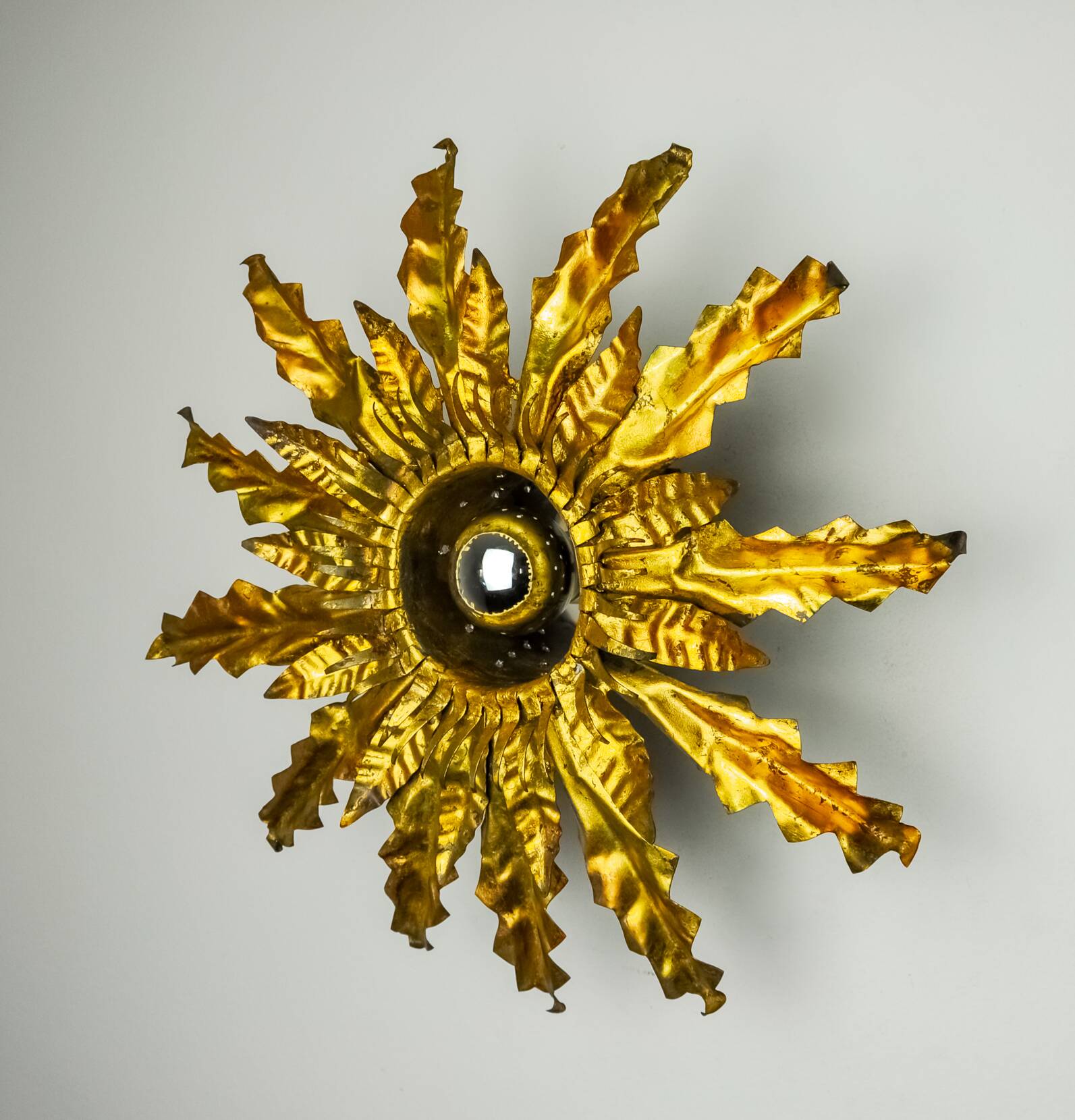 Brutalist sun wall lamp, metal and gold leaf, Italy, 1960