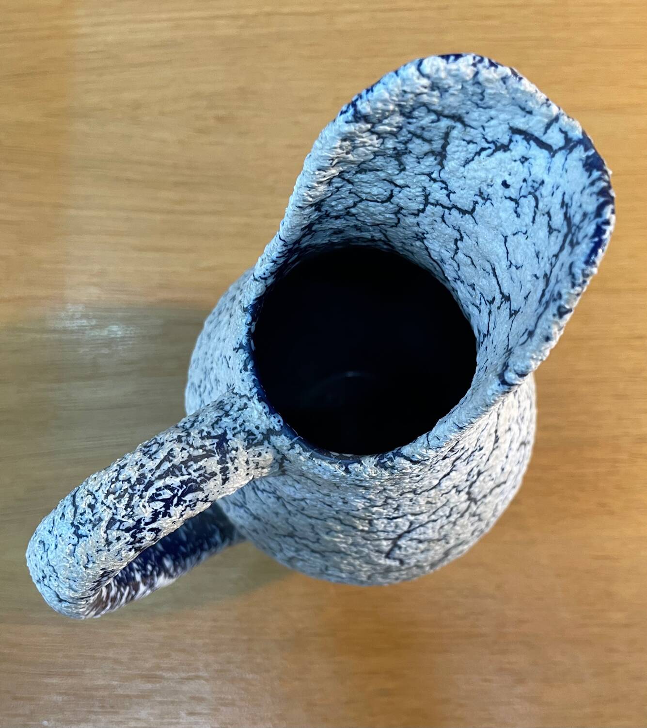 White and blue crisped ceramic pitcher