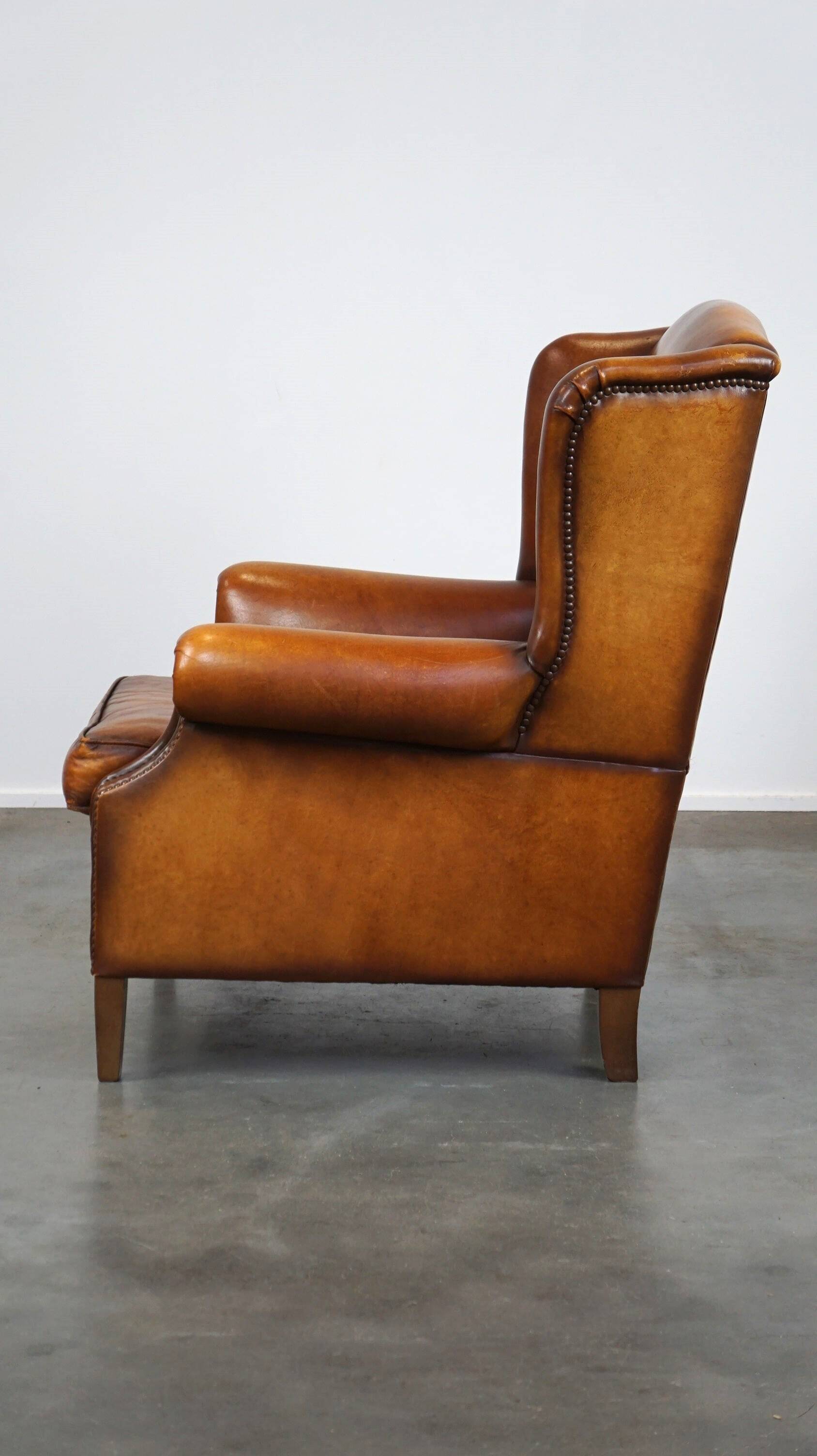 Beautiful and Comfortable Sheepskin Wingback Armchair with a Wonderful Patina