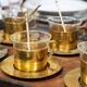 Mid-century tea service in patinated brass and glass